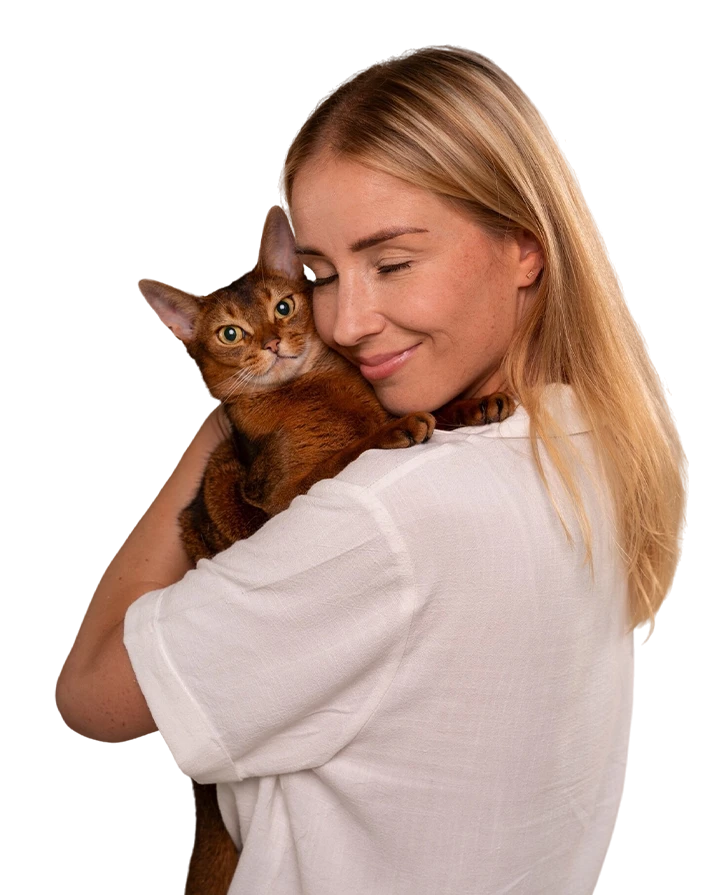 smiling woman holding her cat